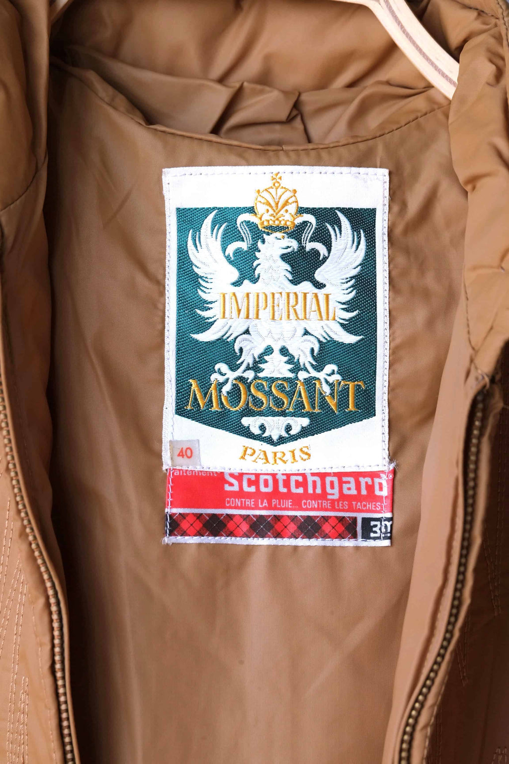 Close-up of the interior Imperial MOSSANT Paris label with an authentic red Scotchgard treatment tag.