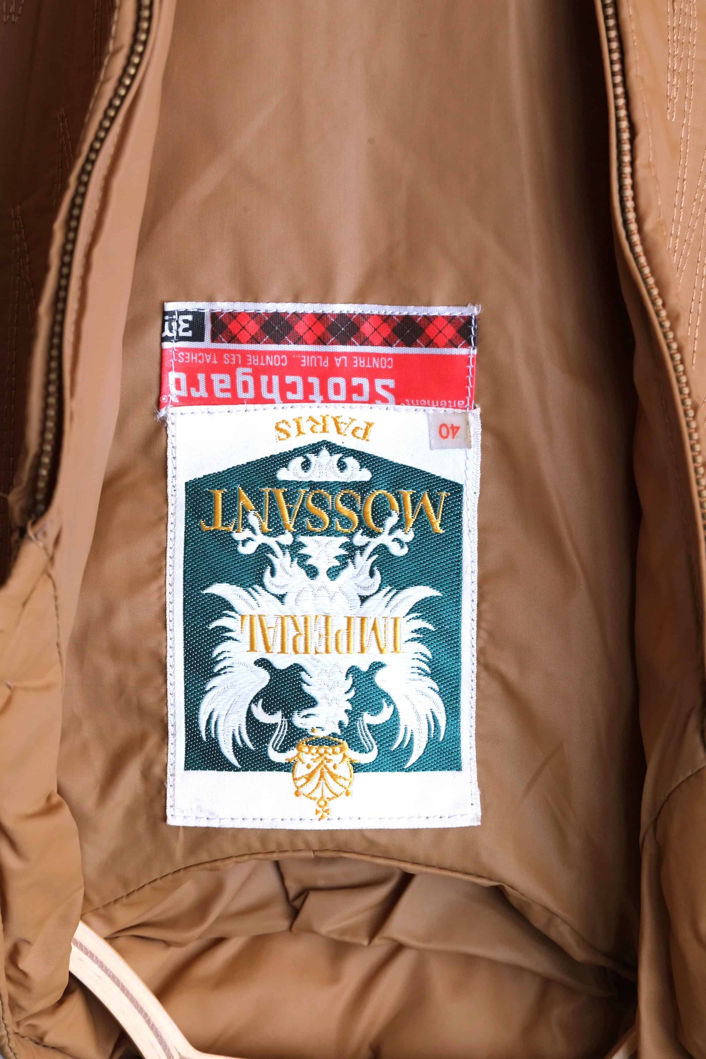 Close-up of the interior Imperial MOSSANT Paris label with an authentic red Scotchgard treatment tag.