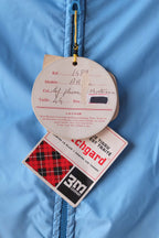 Close up of the original hangtags showing the jacket details, reference number, model name, color and size. Also visible the Scotchgard 3M tag.