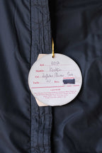 Close up of the original hangtags of the Vodka Mossant jacket.