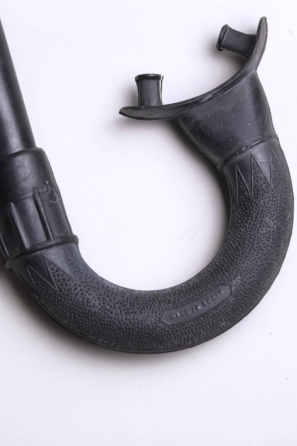Close up of the mouthpiece of a Vintage Nemrod Menorca snorkel on white background