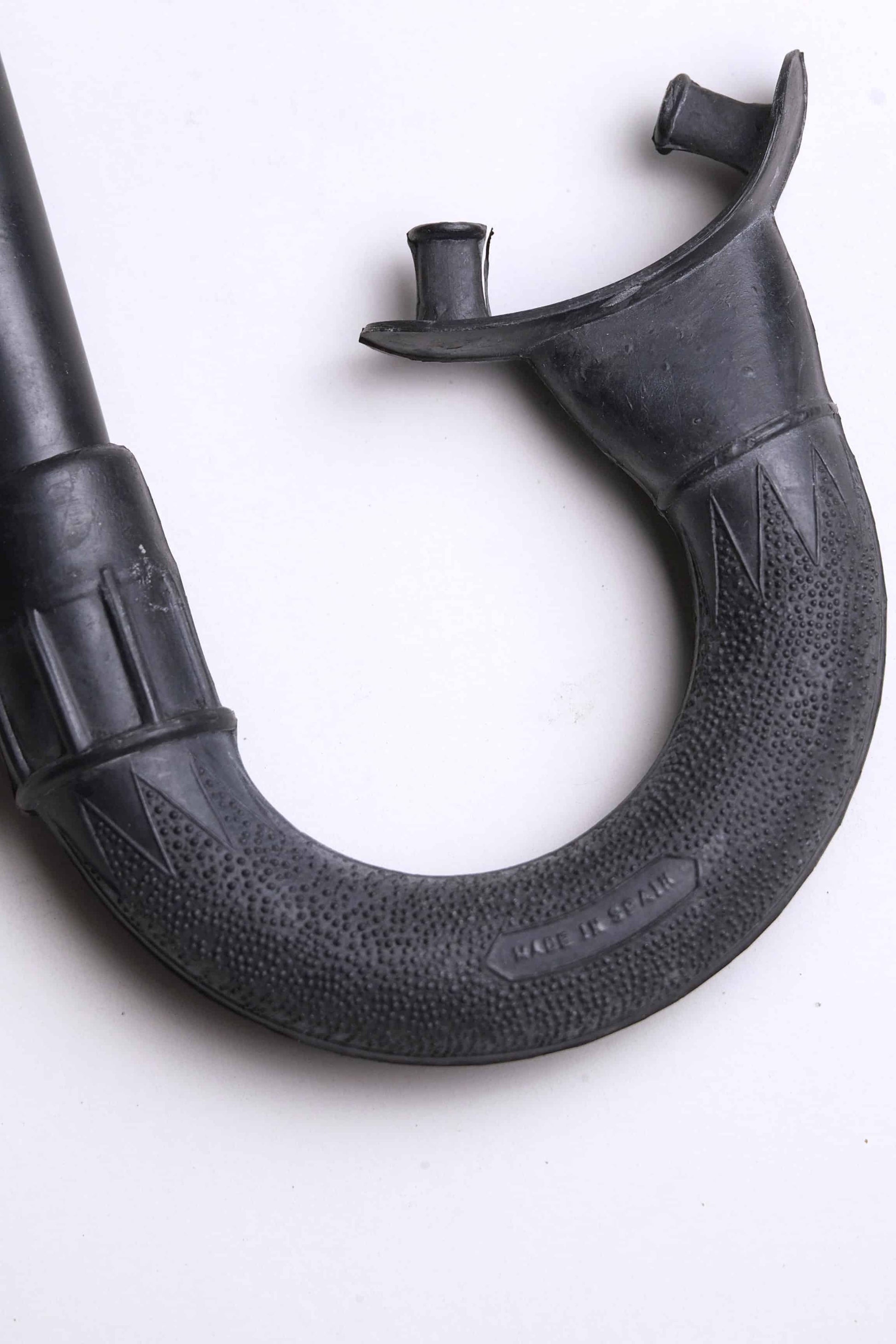 Close up of the mouthpiece of a Vintage Nemrod Menorca snorkel on white background
