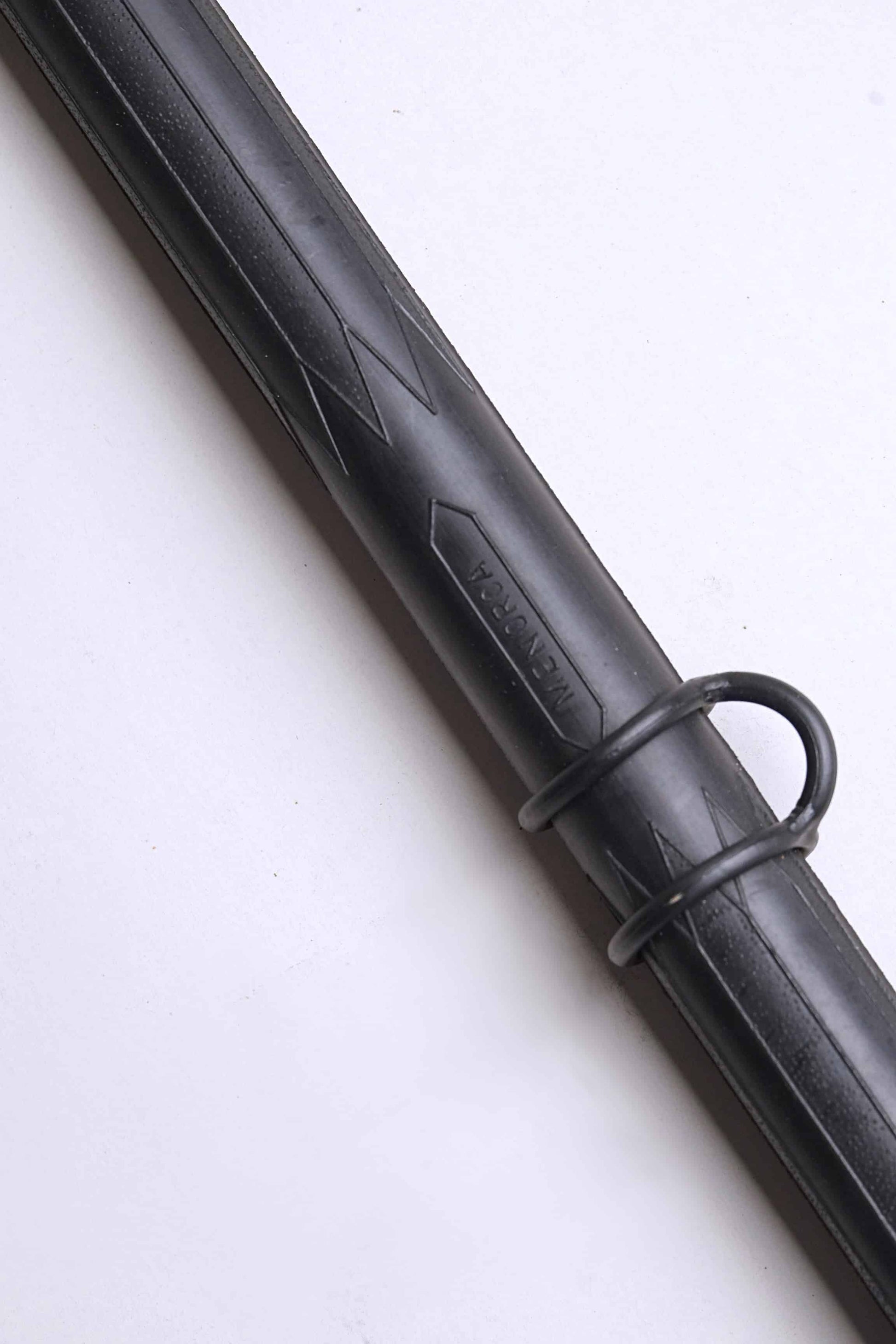 Close up of a Vintage Nemrod Menorca snorkel on white background, showing the word Menorca.