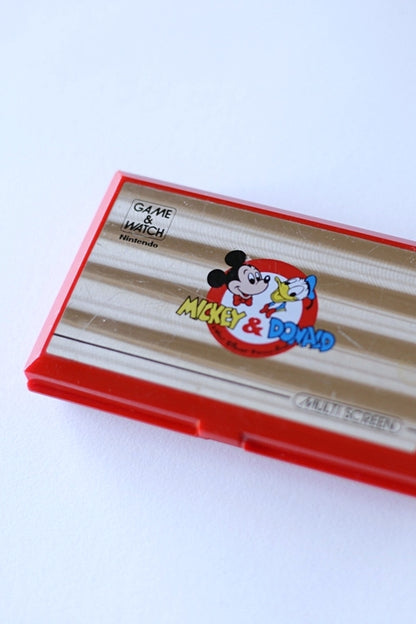 NINTENDO Game & Watch Mickey & Donald closed over white background