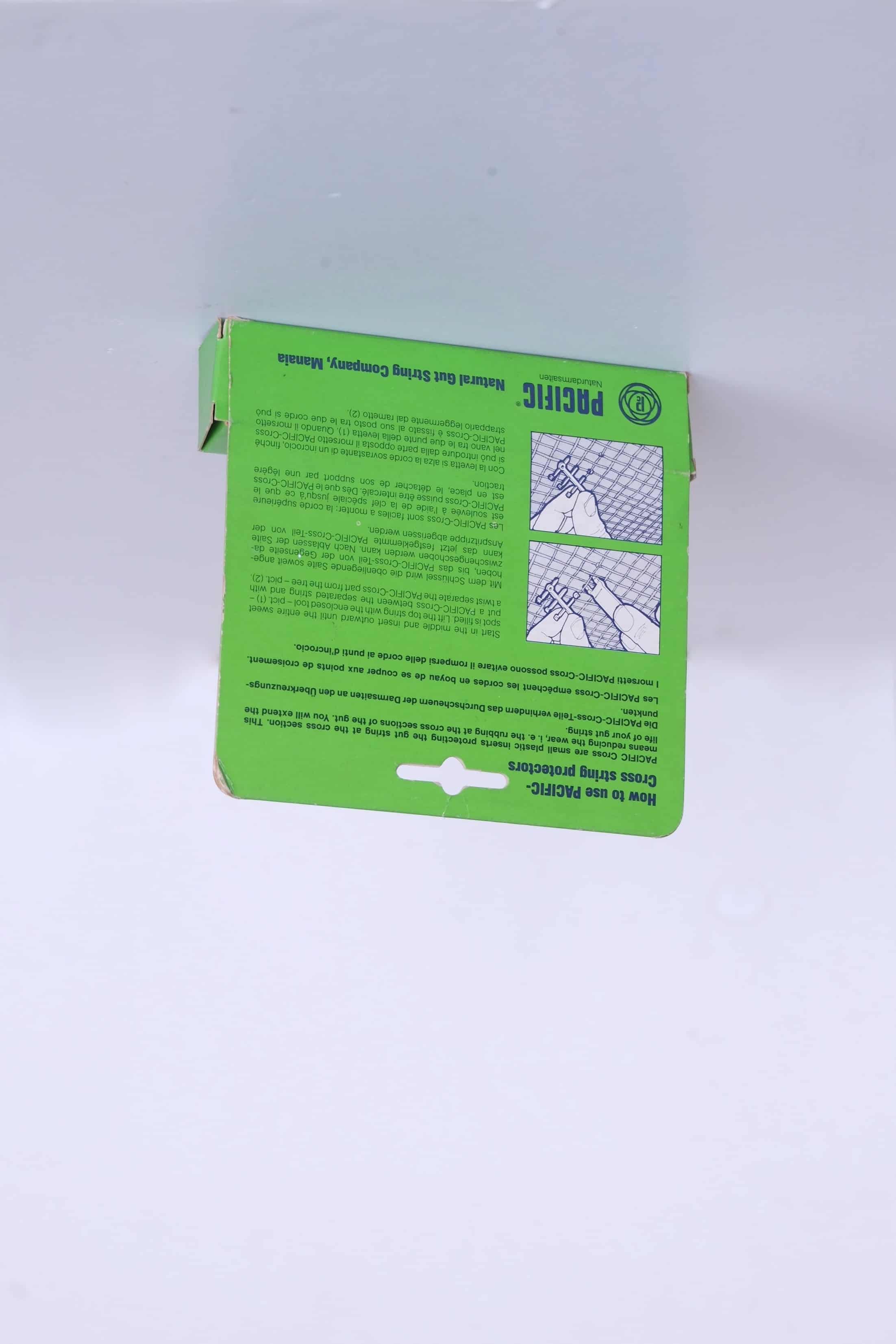 Back view of vintage Pacific Cross packaging, showing printed illustrated instructions for natural gut strings.