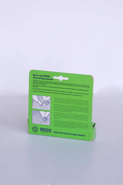 Back view of vintage Pacific Cross packaging, showing printed illustrated instructions for natural gut strings.