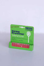 Vintage Pacific Cross string protectors in red, displayed in their original bright green retail card packaging.