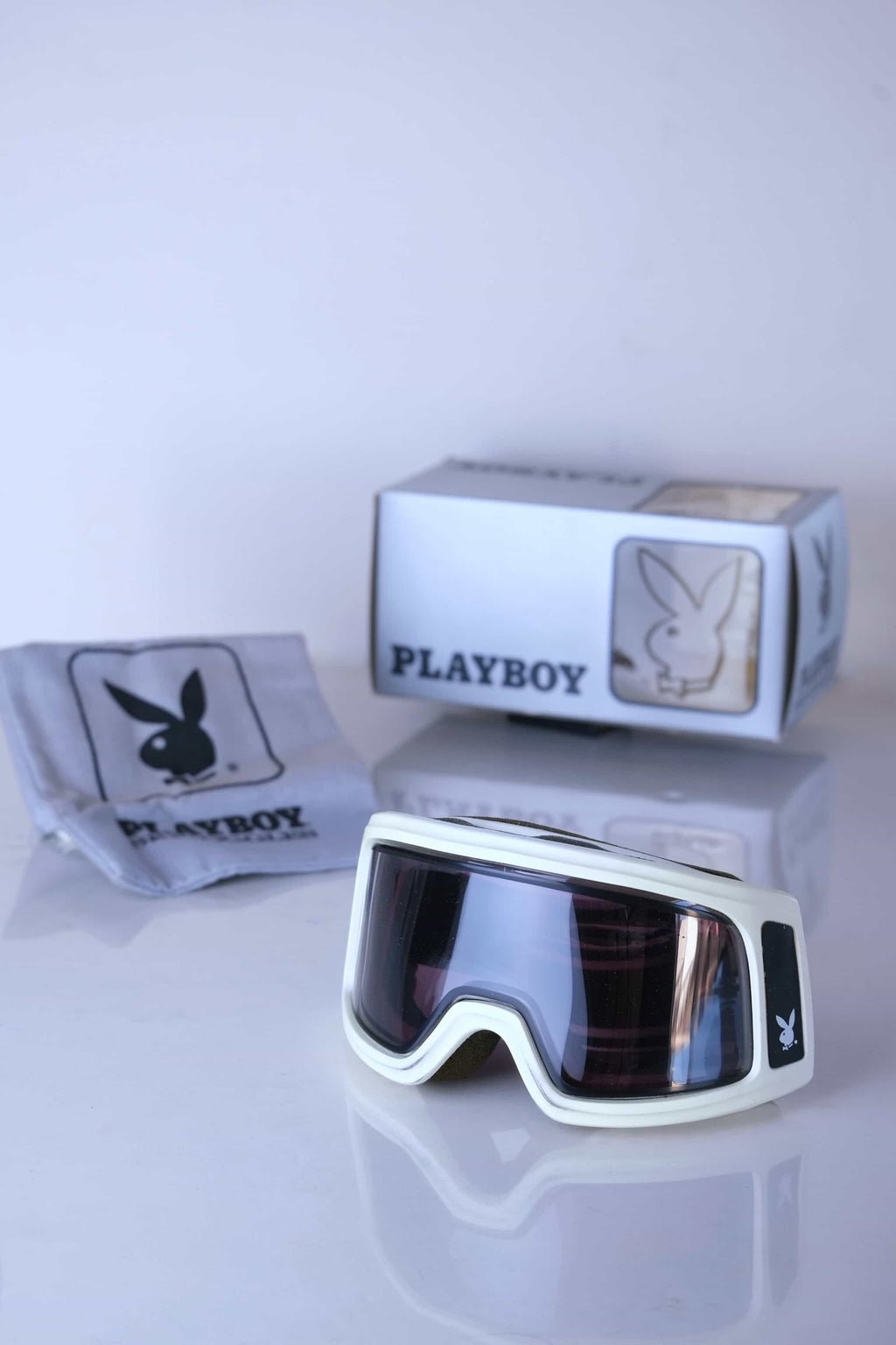 The complete vintage Playboy Chicago set, including goggles, original silver box, and grey dust bag.