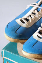 Close-up view of toe caps and suede bumpers on vintage 1970s deadstock blue Puma Top Fit trainers.