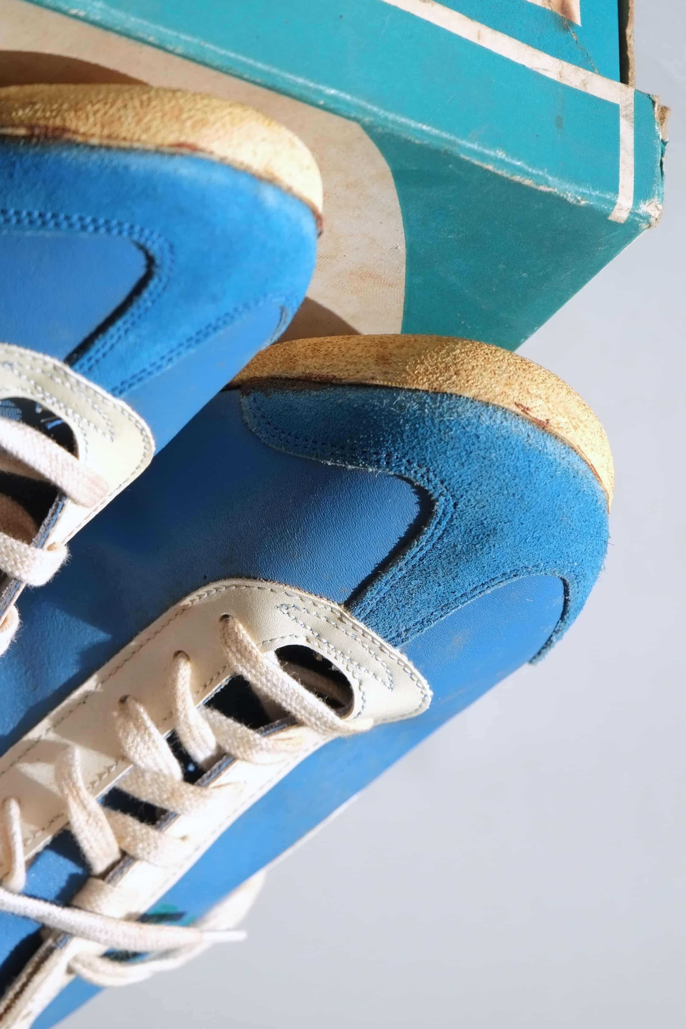 Close-up view of toe caps and suede bumpers on vintage 1970s deadstock blue Puma Top Fit trainers.