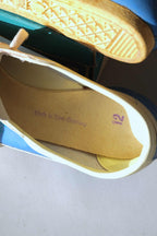 Interior insole view showing purple Made in West Germany and size 12 stamps inside vintage 1970s Puma Top Fit shoe.