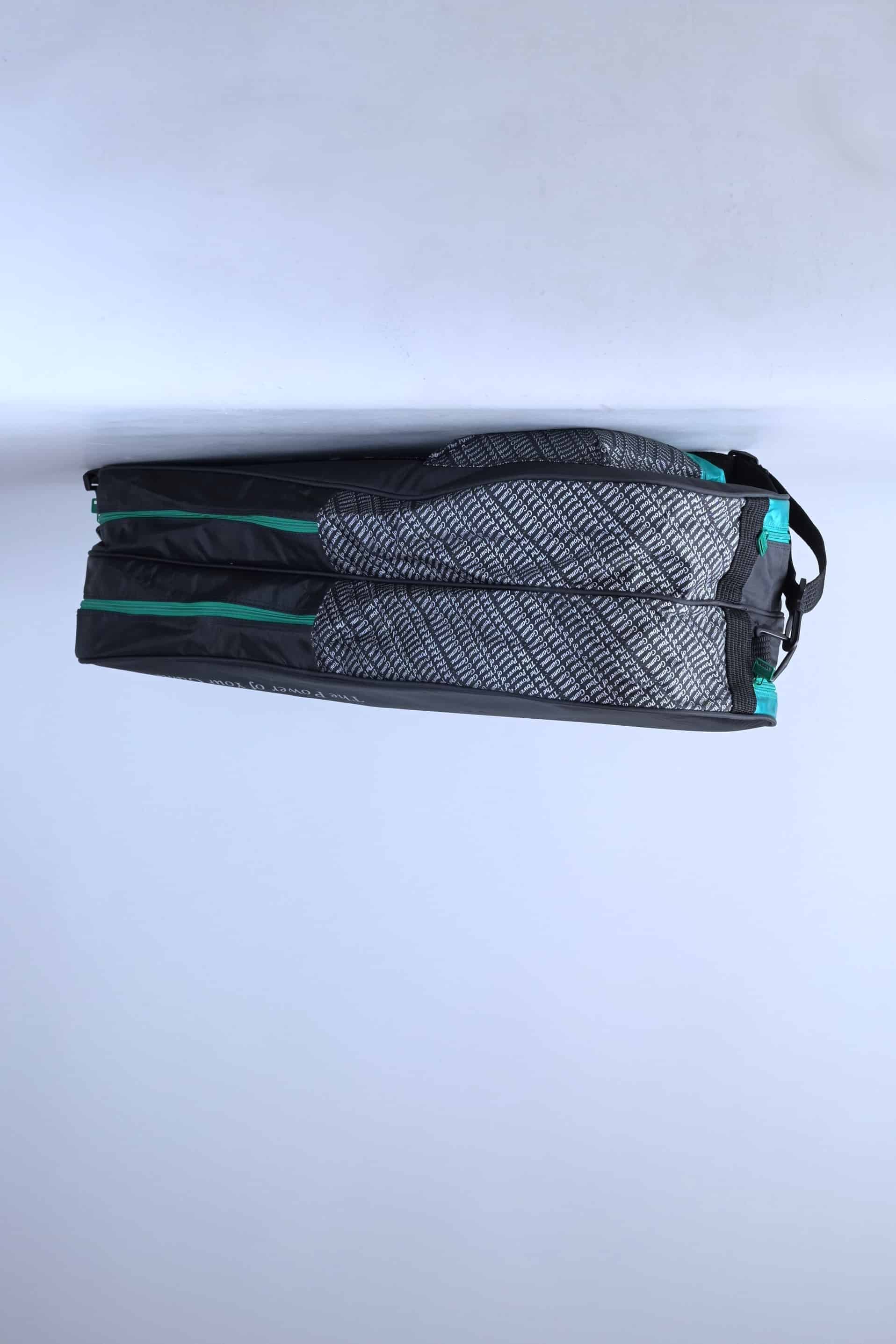 Underside view of the vintage Pacific tennis bag, showcasing the clean green and black synthetic base panels.