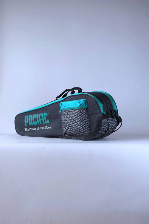 Angled view of the vintage Pacific multi-racket tennis bag, highlighting its classic two-tone paneled design.