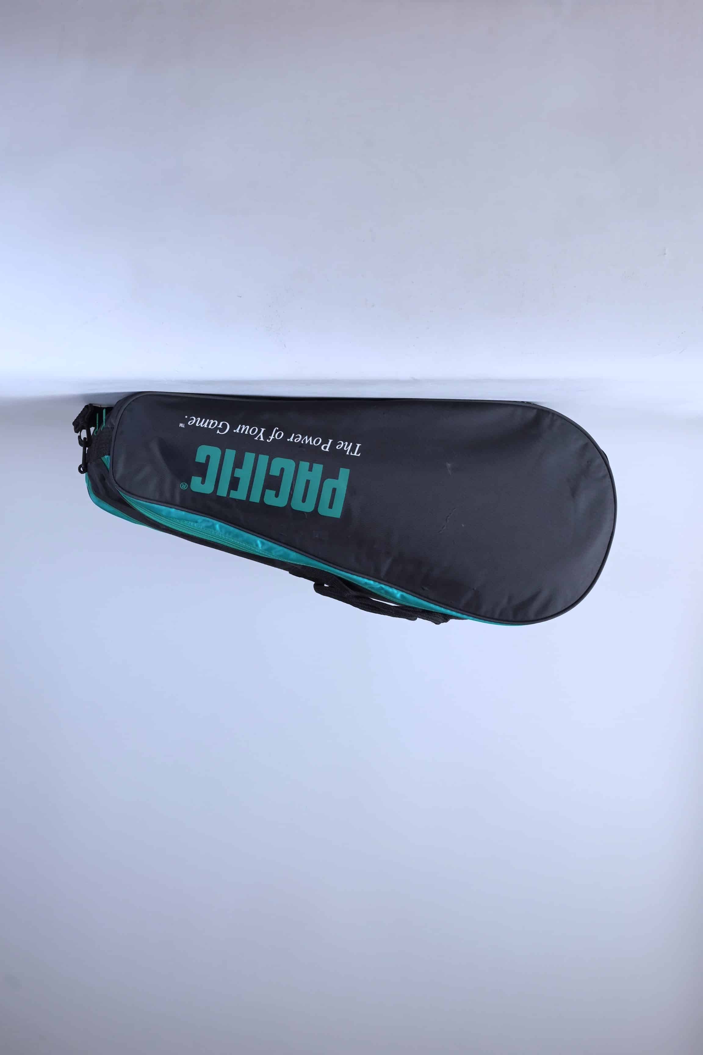 Side view of a vintage 1990 Pacific 6-racket thermal tennis bag in black, green, and white.