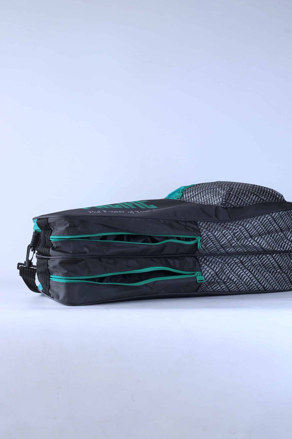 Open view of the vintage Pacific tennis bag's dual main compartments, showing the interior storage.