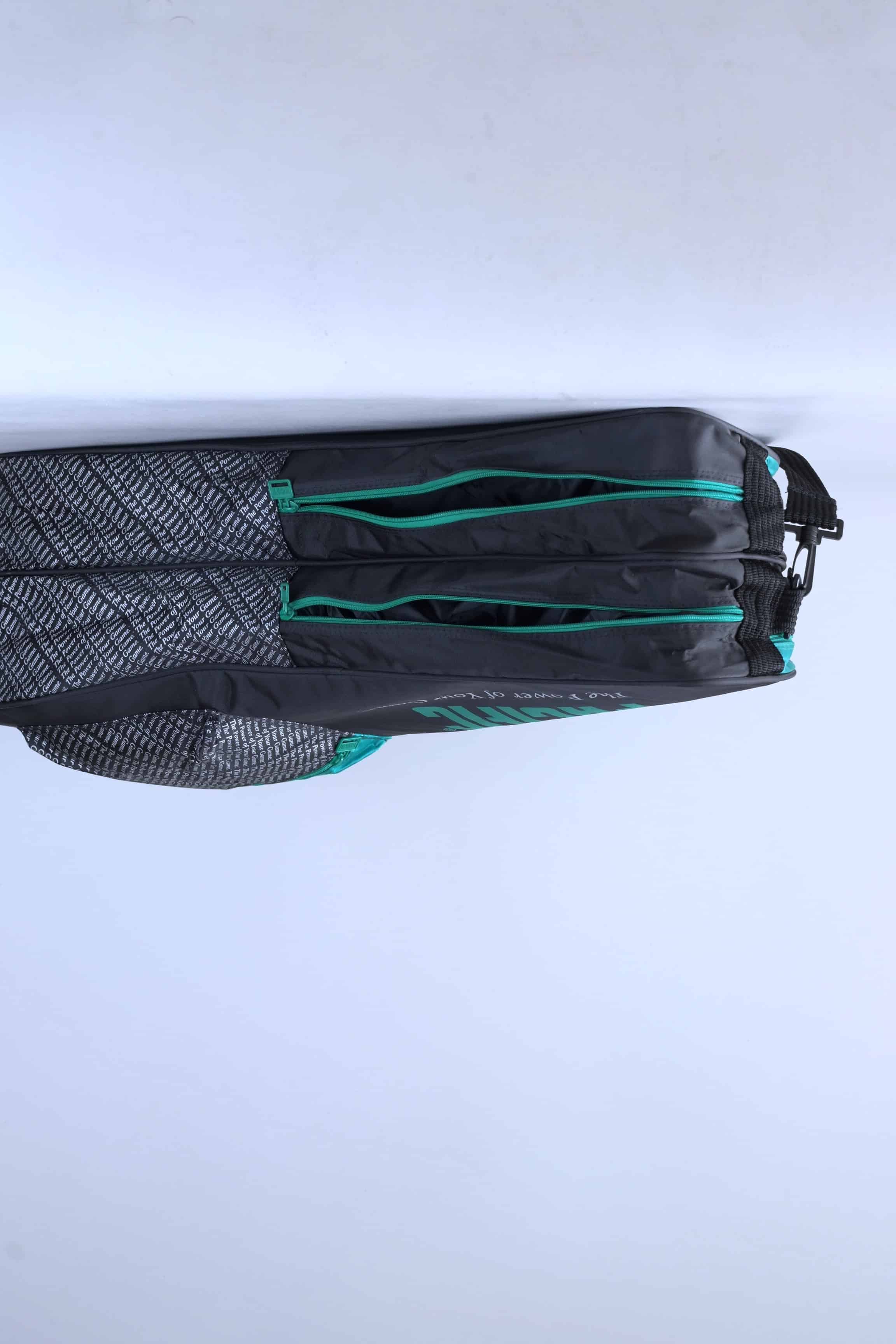 Open view of the vintage Pacific tennis bag's dual main compartments, showing the interior storage.