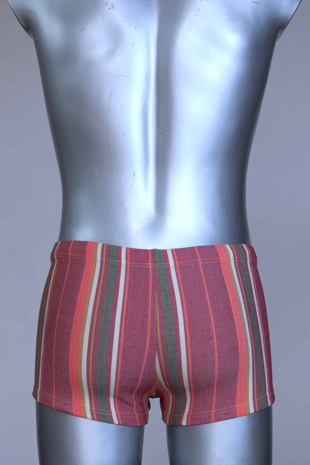 Back view of RIBANA vintage 70s swim trunks in shades of red and striped pattern, shown on a silver mannequin.