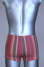 Back view of RIBANA vintage 70s swim trunks in shades of red and striped pattern, shown on a silver mannequin.