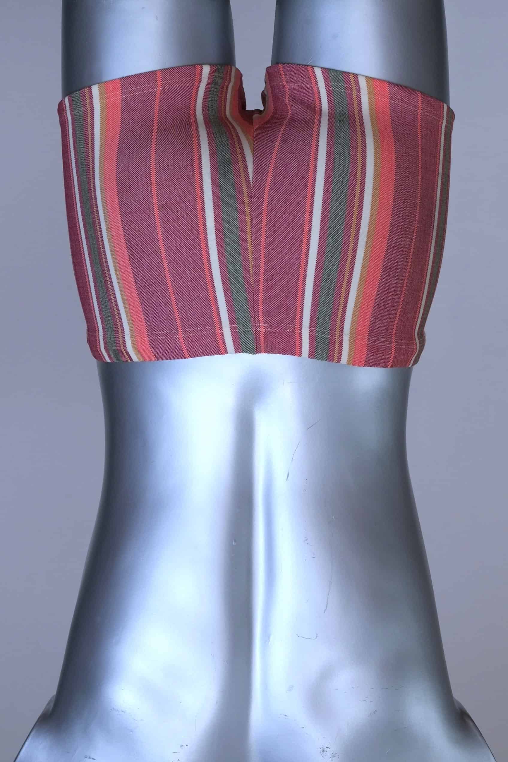 Back view of RIBANA vintage 70s swim trunks in shades of red and striped pattern, shown on a silver mannequin.