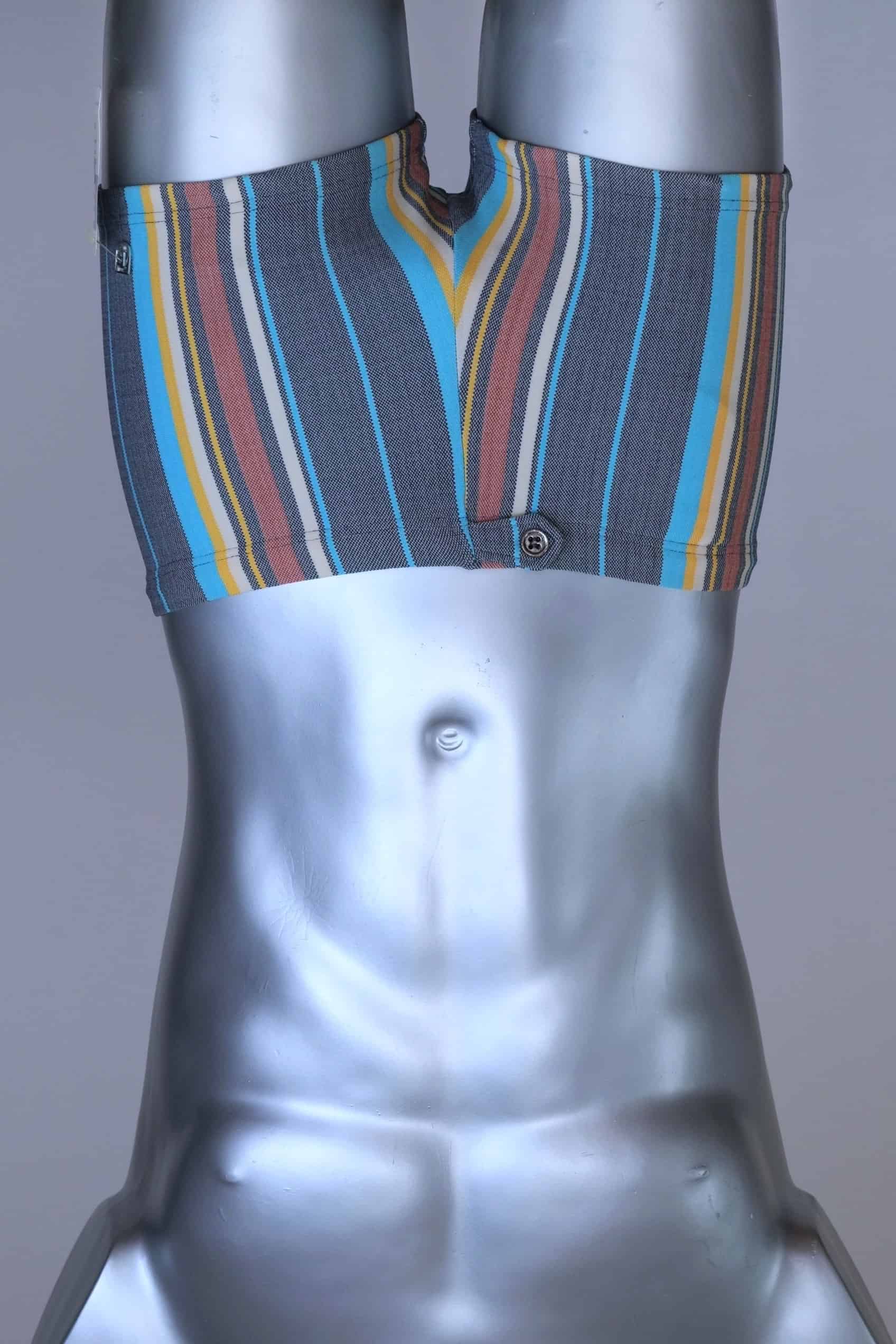 Front view of RIBANA vintage 70s swim trunks in shades of blue striped pattern, shown on a silver mannequin.