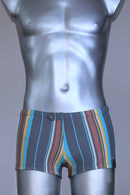 Front view of RIBANA vintage 70s swim trunks in shades of blue striped pattern, shown on a silver mannequin.