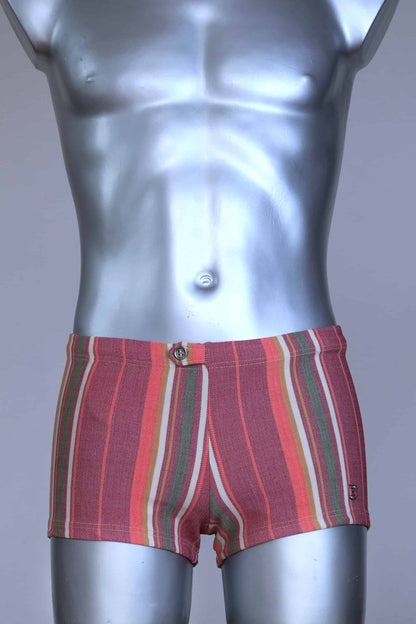 RIBANA vintage 70s swim trunks in shades of red and striped pattern, shown on a silver mannequin.