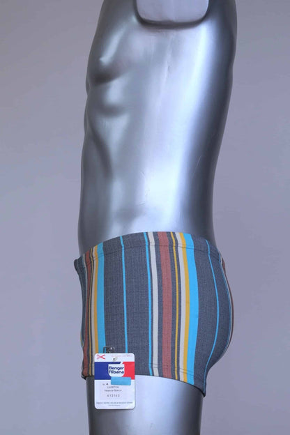 Side view of RIBANA vintage 70s swim trunks in shades of blue striped pattern, shown on a silver mannequin.