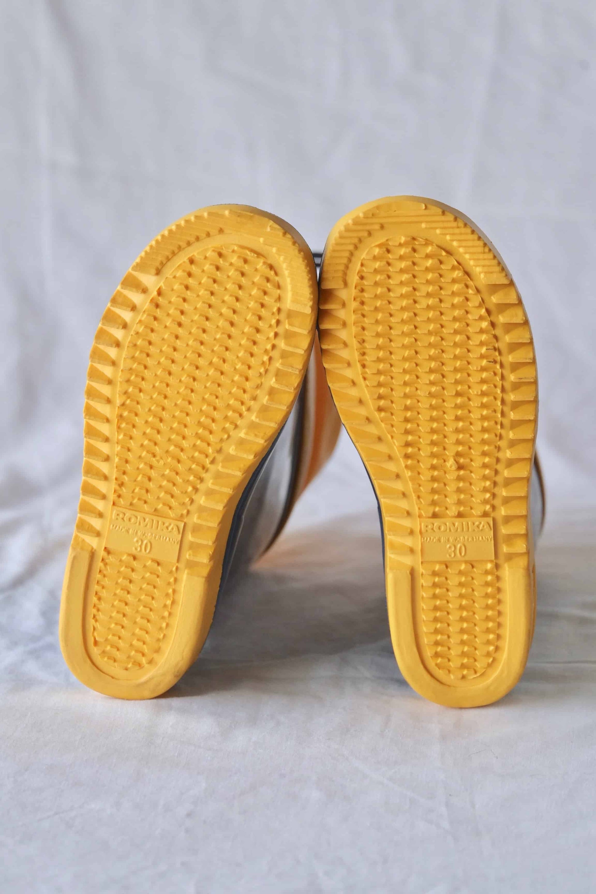 Yellow rubber soles of ROMIKA Bobby Rain Boots