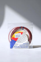 Deadstock vintage Snauwaert Agressor synthetic gut tennis strings in their original gold, blue, and white retail packaging.