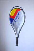 Studio full front shot of an early 80s Snauwaert Graphite Dyno tennis racquet with a black leather grip, including the cover.