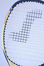 Macro view of the upper racquet hoop emphasizing the unique angled frame design and the red "GRAPHITE - DYNO" model name text.
