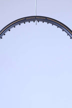 Close-up of the top curve of the racquet frame featuring the "GRAPHITE PRECISION" model name in gold lettering.