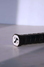 Close-up of the octagonal white butt cap featuring a black stylized "S" logo and the text "YOUR SERVE / MY SERVE".