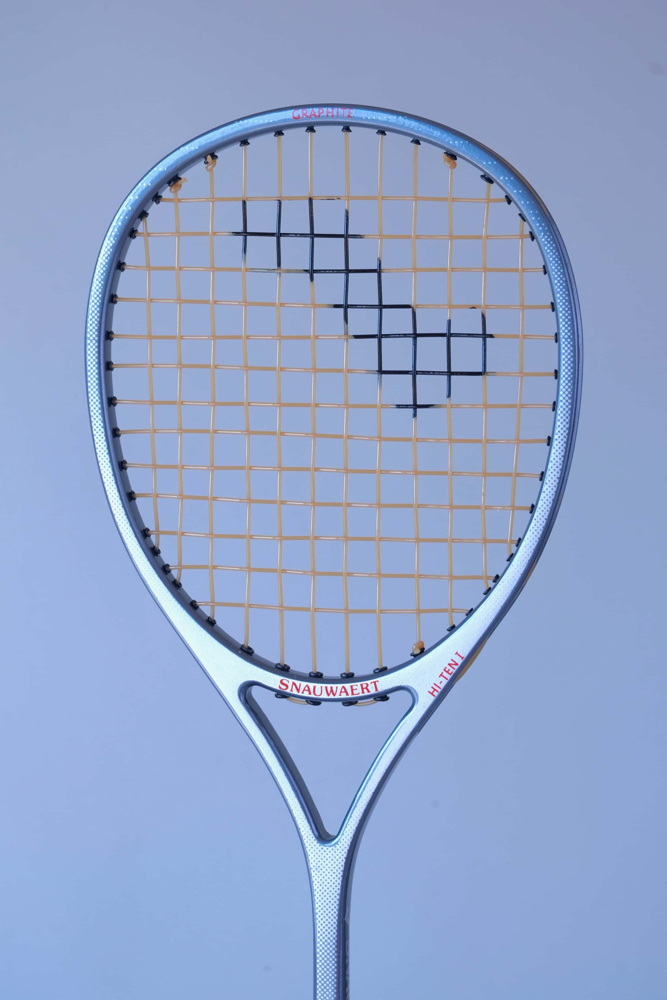 Angled view of the oversized head shape of a vintage Snauwaert Hi-Ten I squash racket.