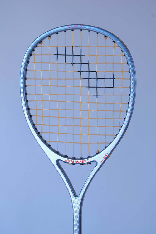 Angled view of the oversized head shape of a vintage Snauwaert Hi-Ten I squash racket.