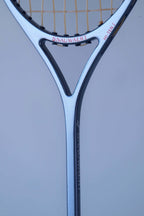 Close-up of the glossy black and silver racket shaft detailing the Snauwaert logo and Hi-Ten I model name.