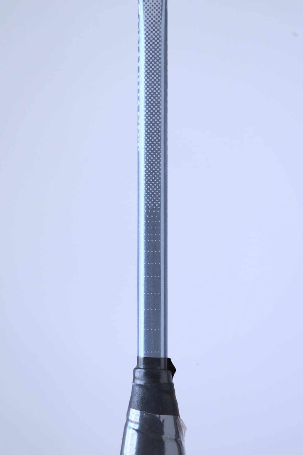 Close-up of the silver racket shaft detailing the Snauwaert logo and Hi-Ten I model name.