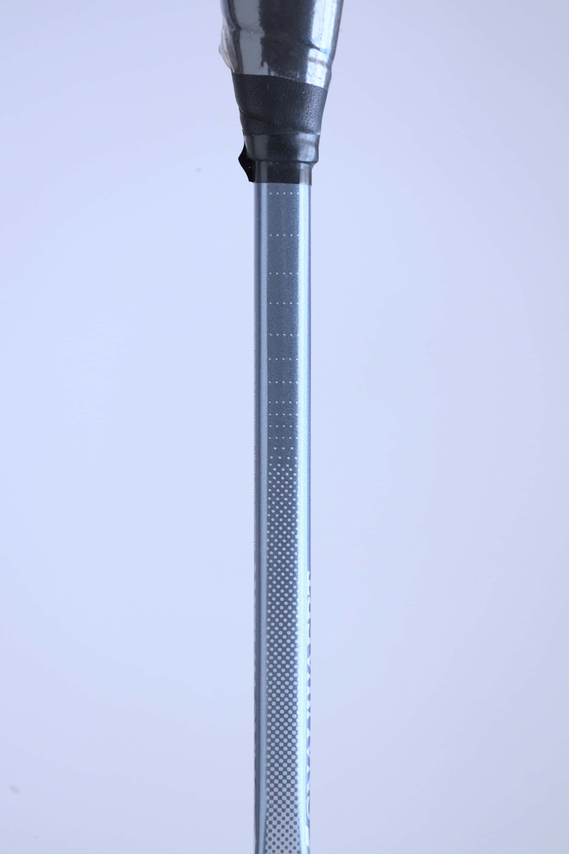 Close-up of the silver racket shaft detailing the Snauwaert logo and Hi-Ten I model name.