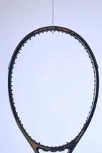 Macro view of the upper racquet hoop featuring the "ROYAL PRECISION • CERAMIC" model name and a red technical graphic.