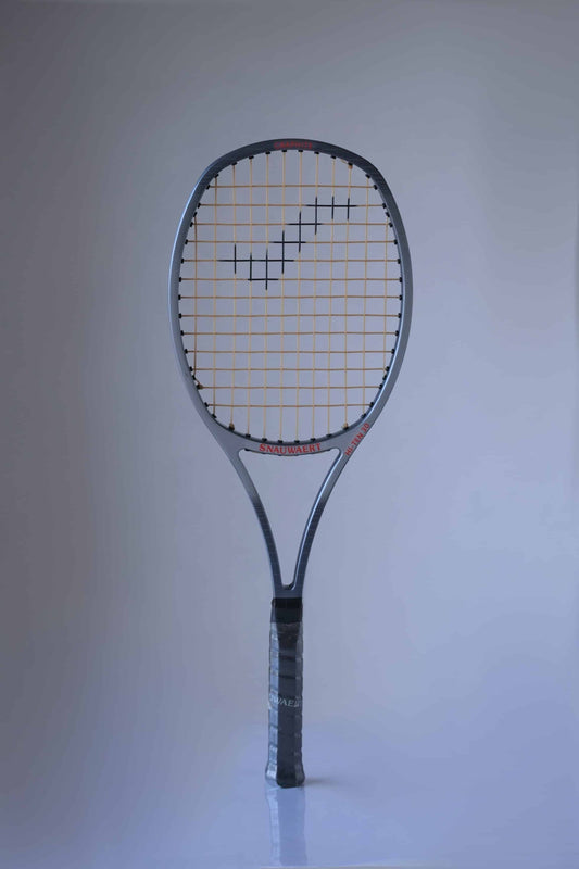 Vintage Snauwaert Hi-Ten 30 tennis racket with a wide head, grey frame, and distinctive string pattern, featuring red branding on the throat.