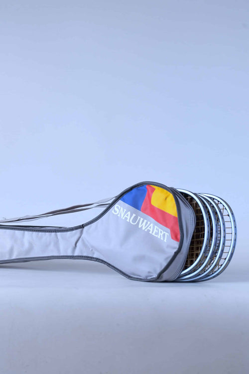 Close-up view of the vintage Snauwaert soft bag, highlighting the capacity, 3 squash rackets are peaking out.