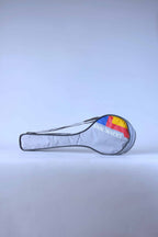 Full view of a vintage grey Snauwaert squash racket soft bag with a shoulder strap and red, yellow and blue brand logo.