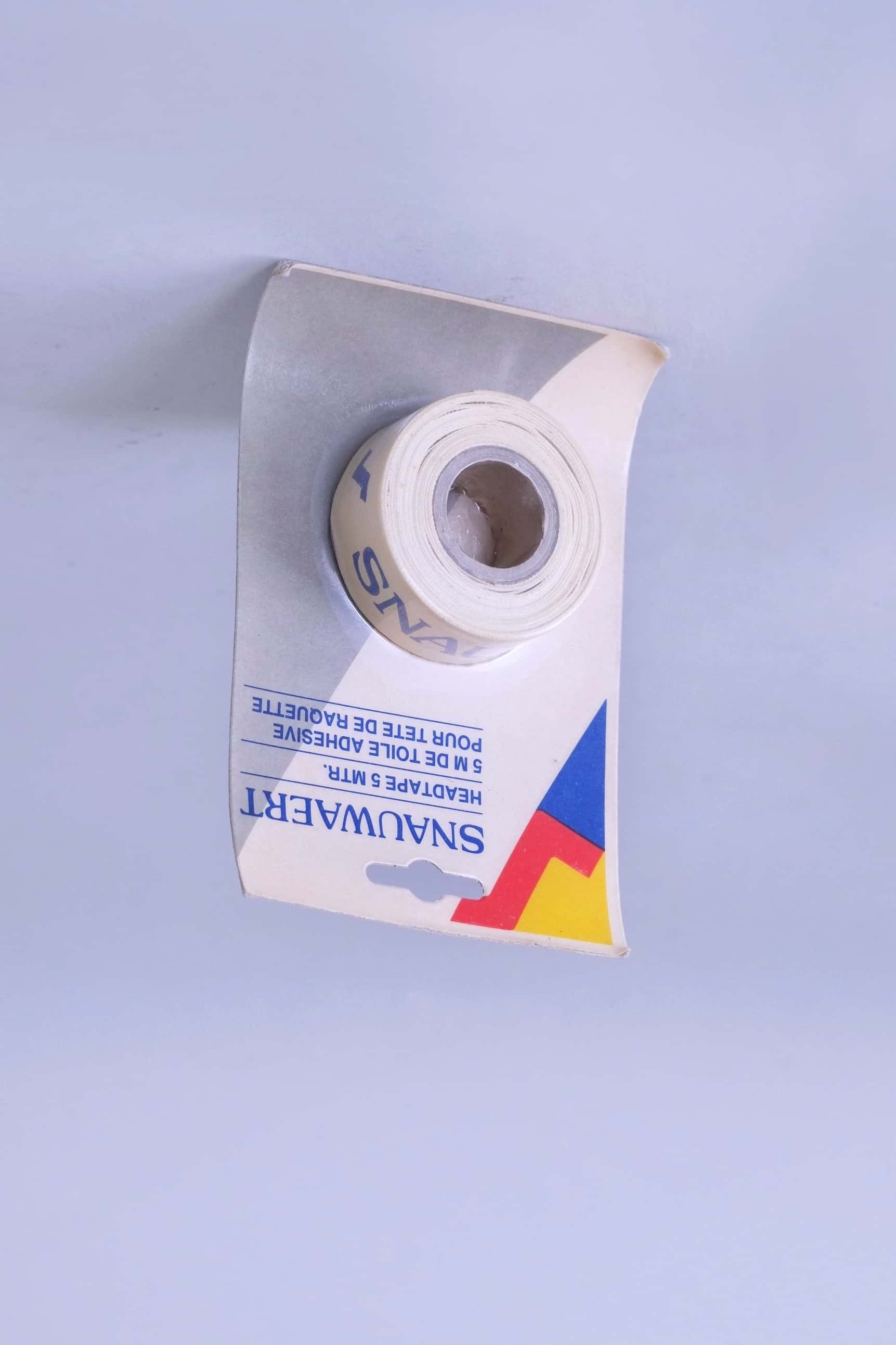 Angled view of deadstock vintage Snauwaert 5-meter adhesive frame protection tape for tennis racket heads.
