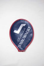 Vintage navy blue vinyl Snauwaert tennis racquet head cover with bright red trim, featuring a white logo and Vitas Gerulaitis signature text.