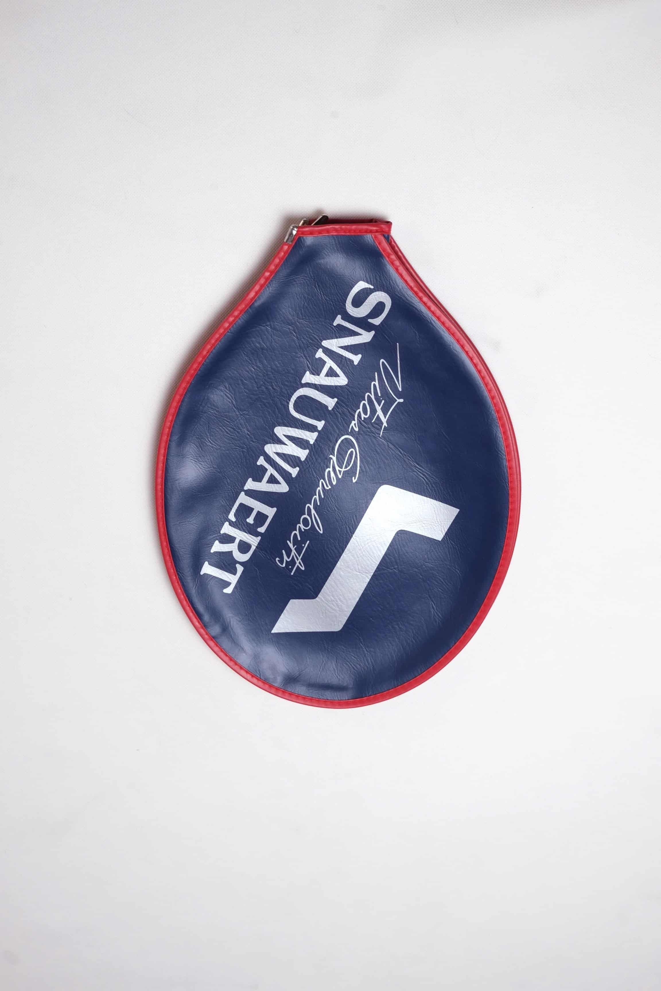 Vintage navy blue vinyl Snauwaert tennis racquet head cover with bright red trim, featuring a white logo and Vitas Gerulaitis signature text.