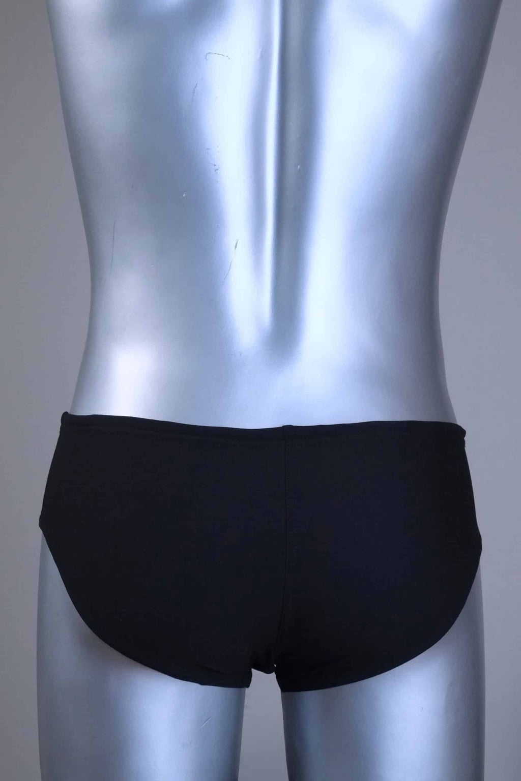 Back view of a pair of a Vintage Black men's swim briefs with white stripes on a metallic mannequin against a gray background
