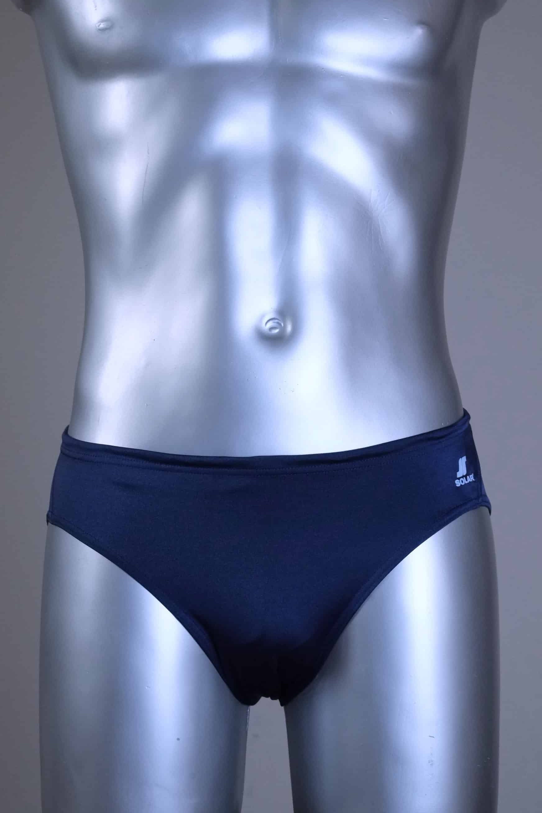 A pair of SOLAR vintage 70s swim briefs in navy shown on a silver mannequin