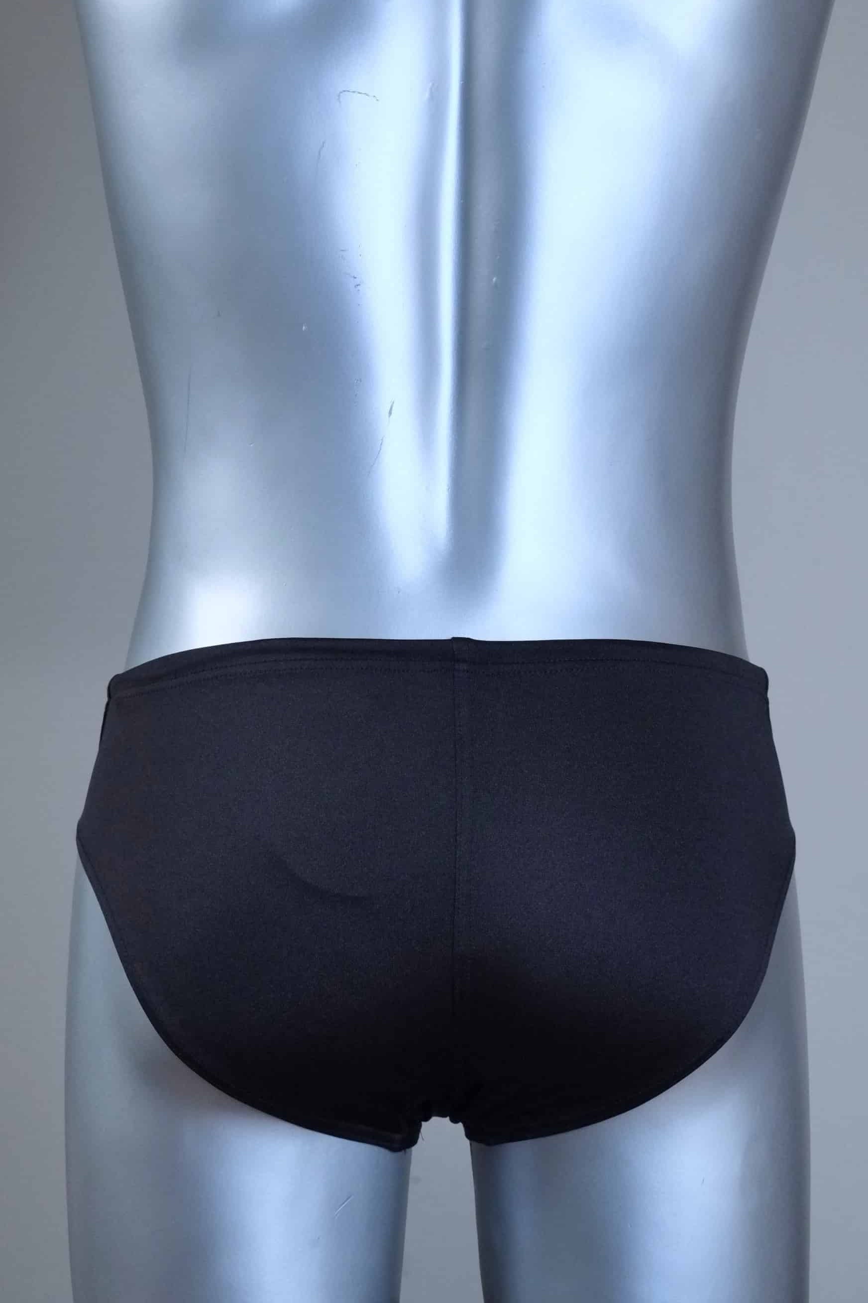 Back view of a pair of SOLAR vintage 70s swim briefs in black shown on a silver mannequin