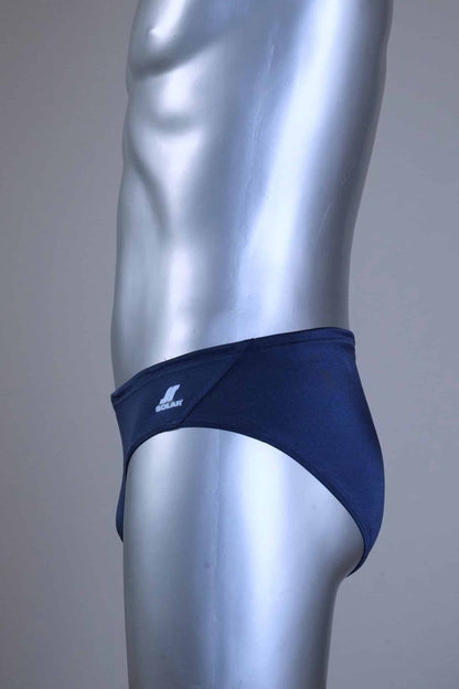 Side of a pair of SOLAR vintage 70s swim briefs in navy shown on a silver mannequin