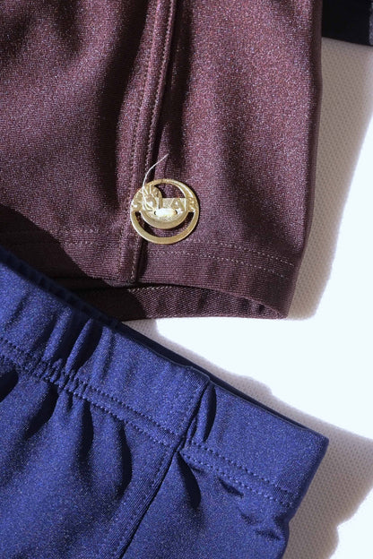 Gold metal logo badge detail